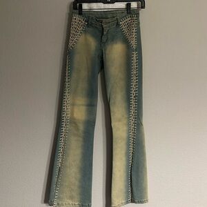 Jeans with crochet design on the sides 
Size 4
Smoke free & pet free house.
